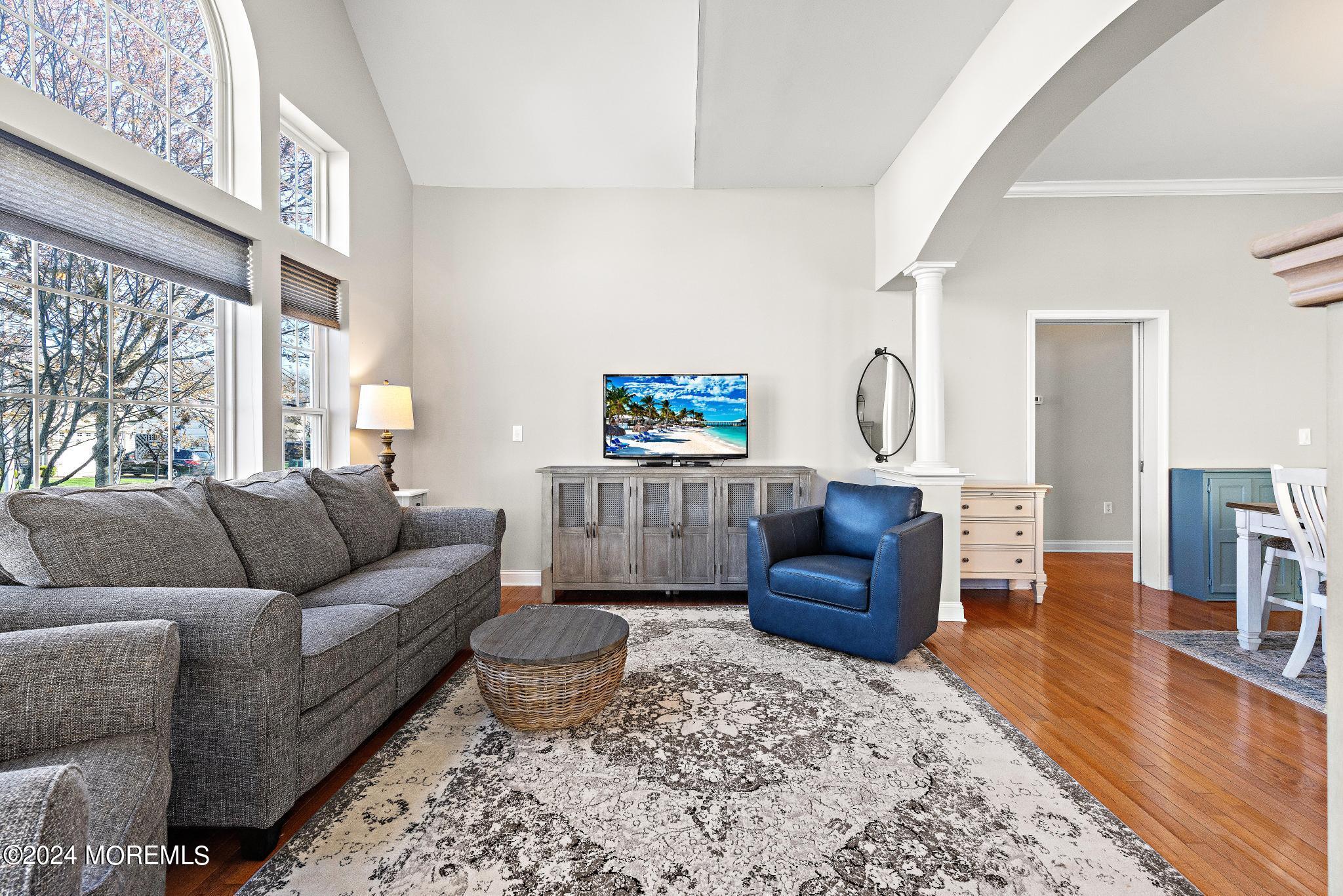 25 Firestone Drive Howell, NJ 07731 - Photo 17 of 65 a living room with furniture and a wooden floor