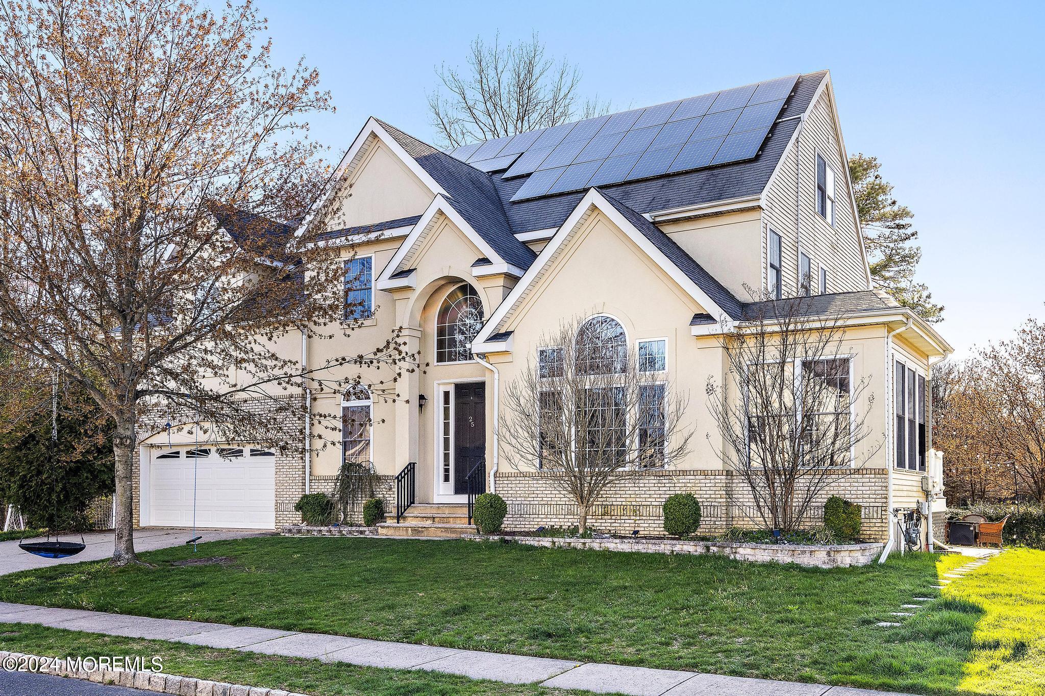 25 Firestone Drive Howell, NJ 07731 - Photo 2 of 65 a view of white house with a yard and plants