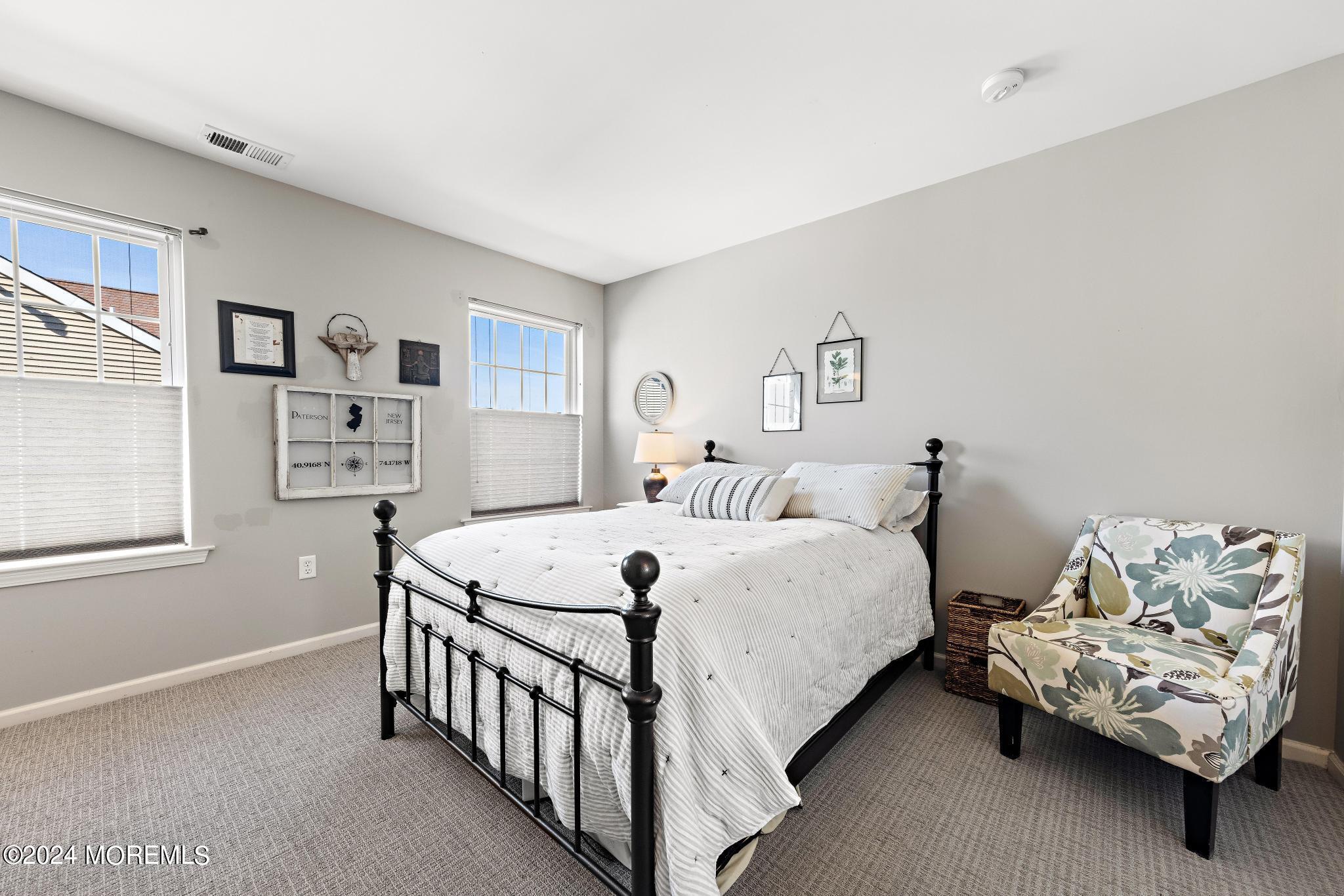 25 Firestone Drive Howell, NJ 07731 - Photo 30 of 65 a bedroom with a bed and a couch