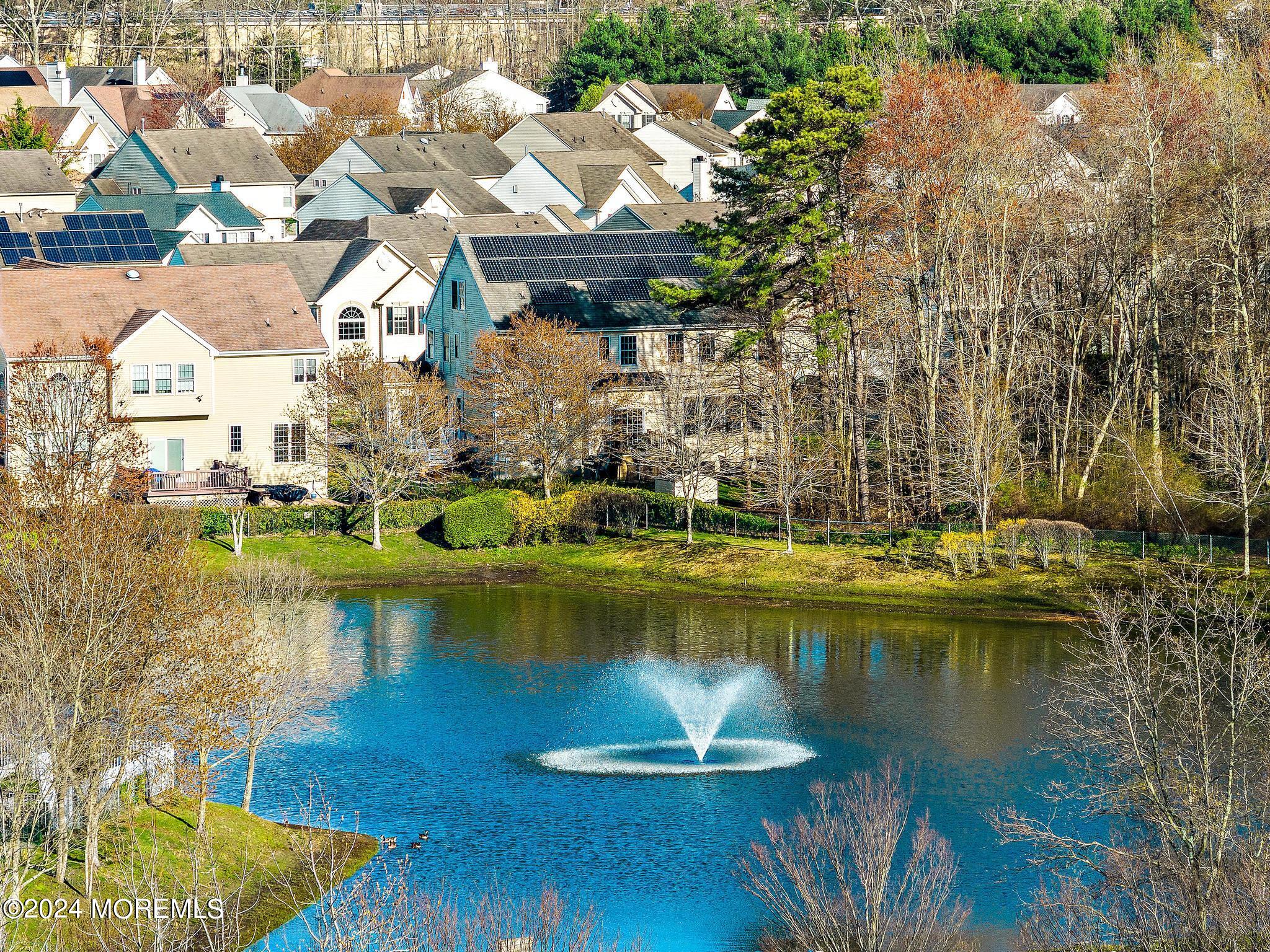 25 Firestone Drive Howell, NJ 07731 - Photo 3 of 65 a view of a lake with a house