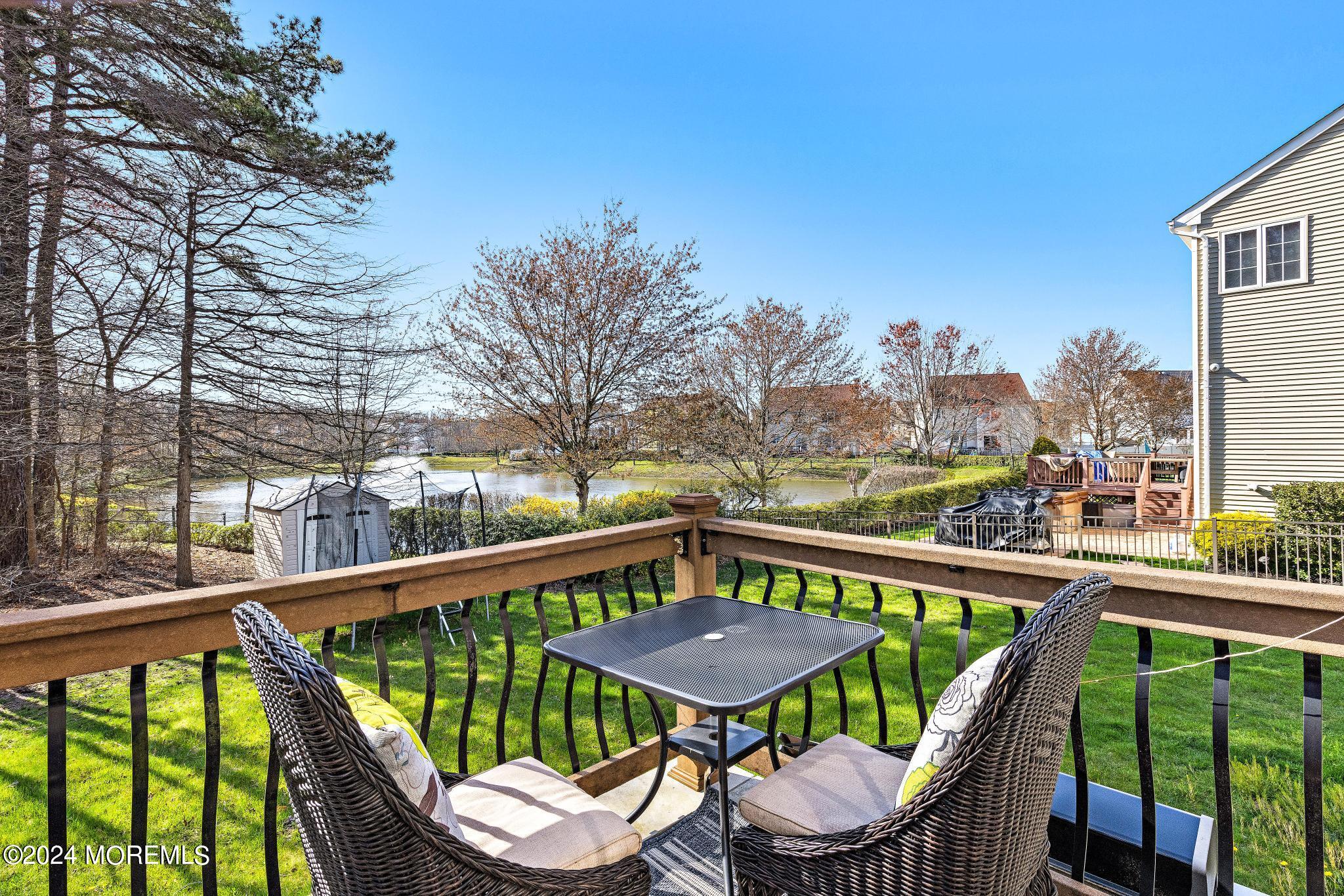 25 Firestone Drive Howell, NJ 07731 - Photo 44 of 65 a view of a balcony with a table and chairs