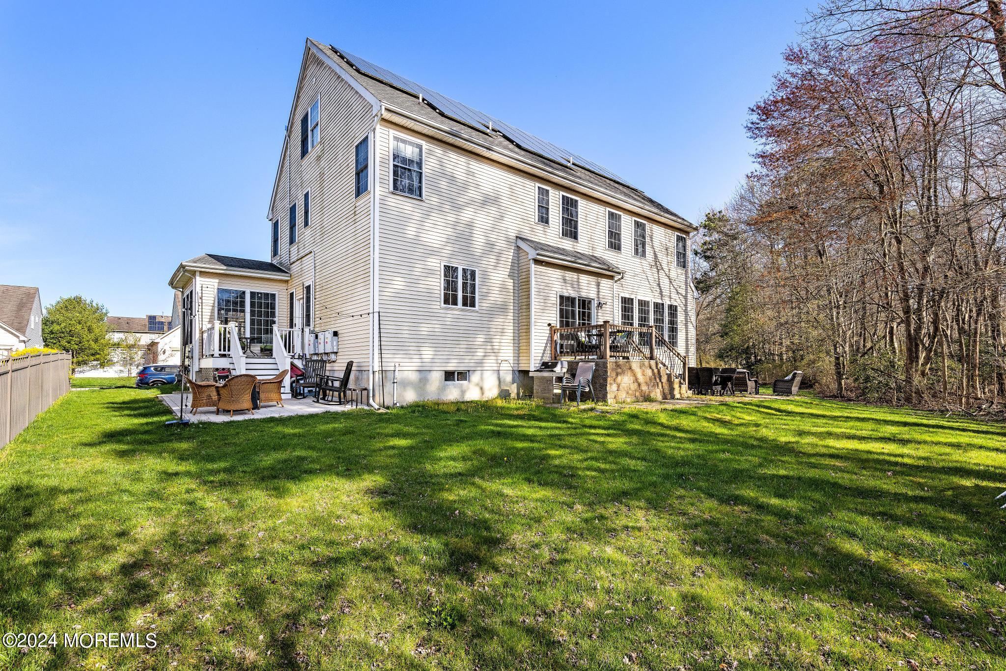 25 Firestone Drive Howell, NJ 07731 - Photo 47 of 65 a view of a house with a swimming pool and a yard