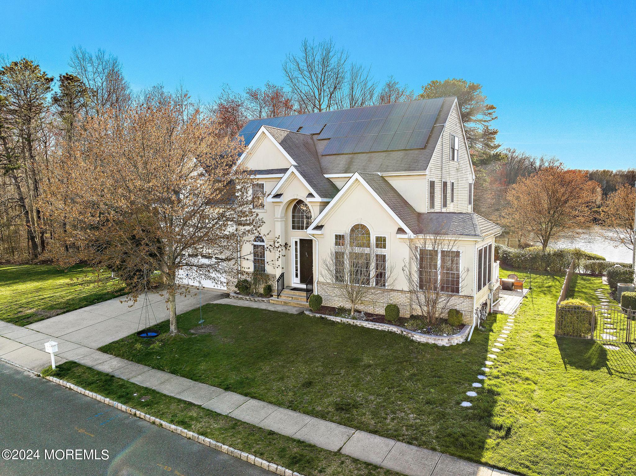 25 Firestone Drive Howell, NJ 07731 - Photo 60 of 65 a view of house with garden and tall trees