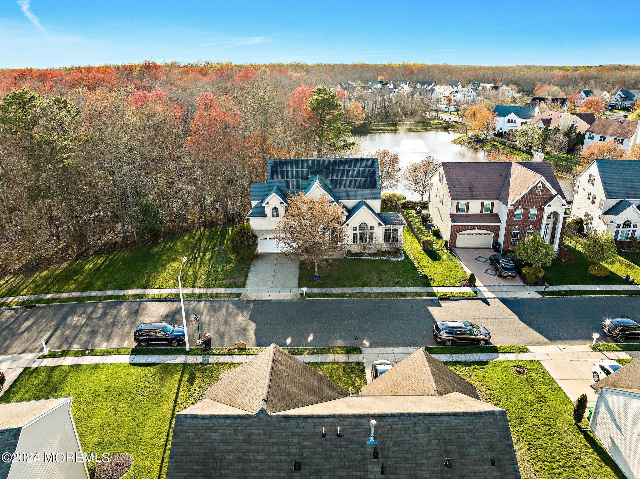 25 Firestone Drive Howell, NJ 07731 - Photo 63 of 65 an aerial view of a house with swimming pool
