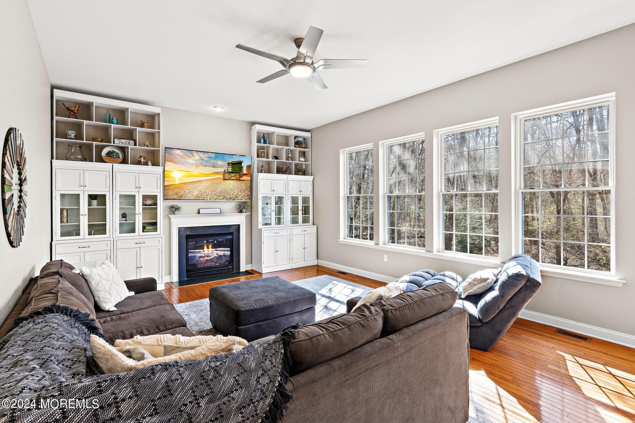 25 Firestone Drive Howell, NJ 07731 - Photo 7 of 65 a living room with furniture fireplace and a large window