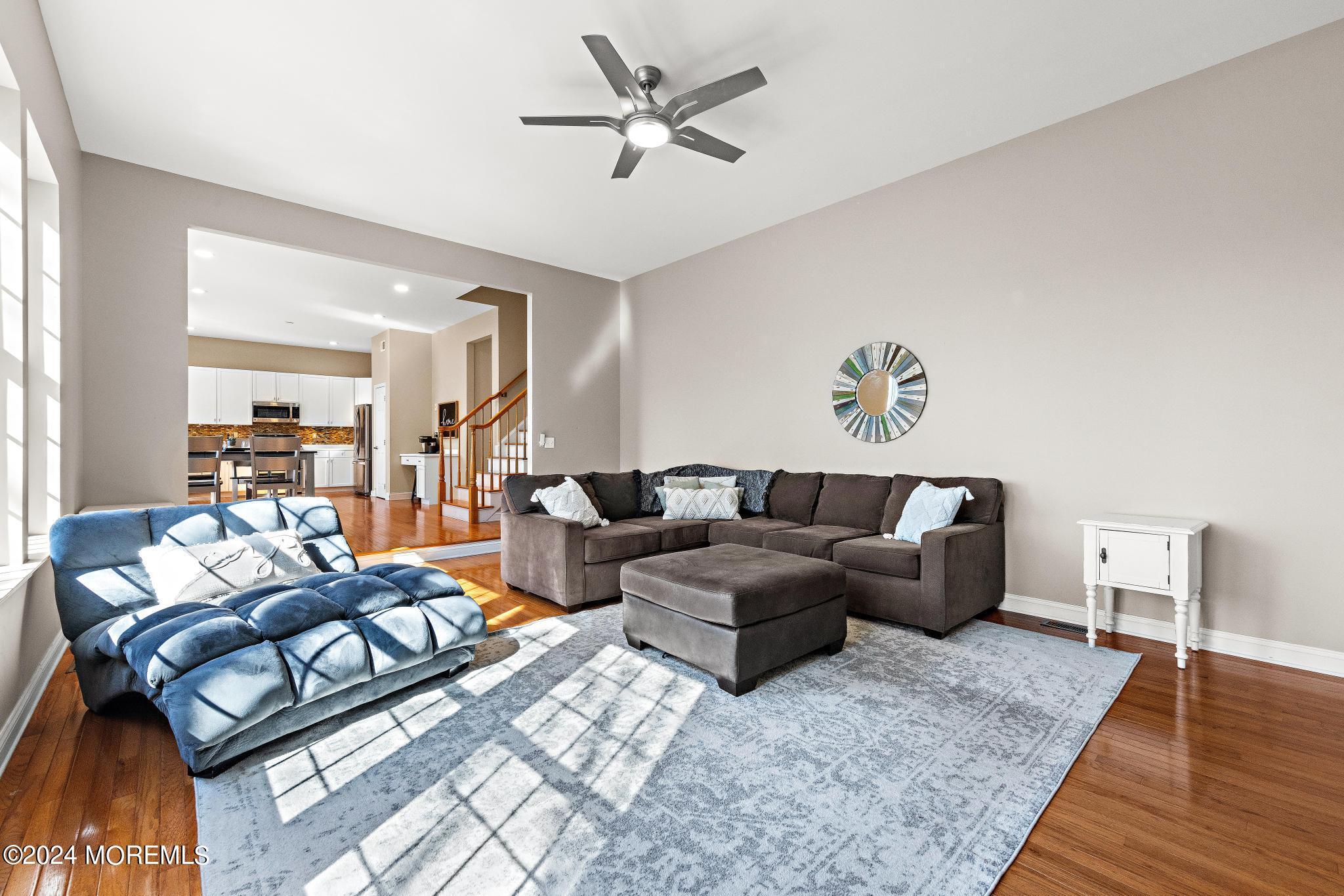 25 Firestone Drive Howell, NJ 07731 - Photo 8 of 65 a living room with furniture and wooden floor