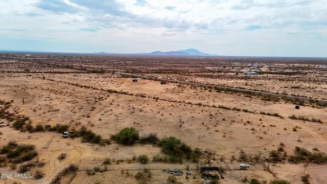 an aerial view of residential building with yard