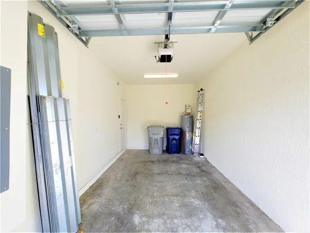 a view of an empty room with a fireplace
