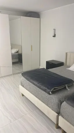 a bedroom with a bed and furniture