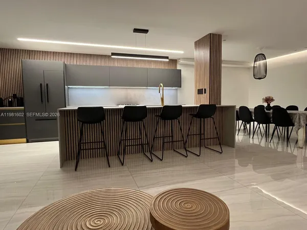 a view of living room filled with furniture and furniture