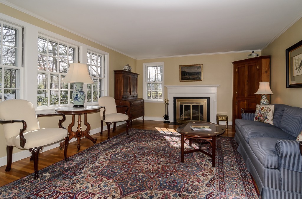 36 Stanford Road Wellesley, MA 02481 - Photo 6 of 22 a living room with furniture and a fireplace