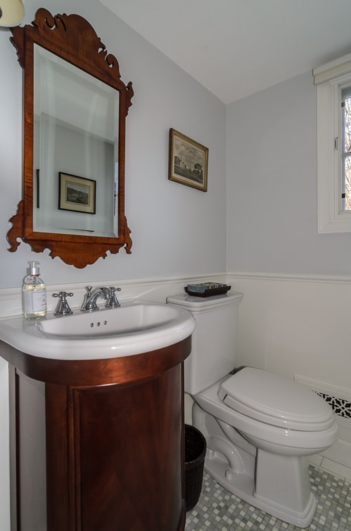 36 Stanford Road Wellesley, MA 02481 - Photo 10 of 22 a bathroom with a toilet a sink and mirror