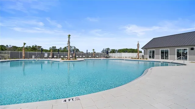 a view of a lake with a yard in front of it