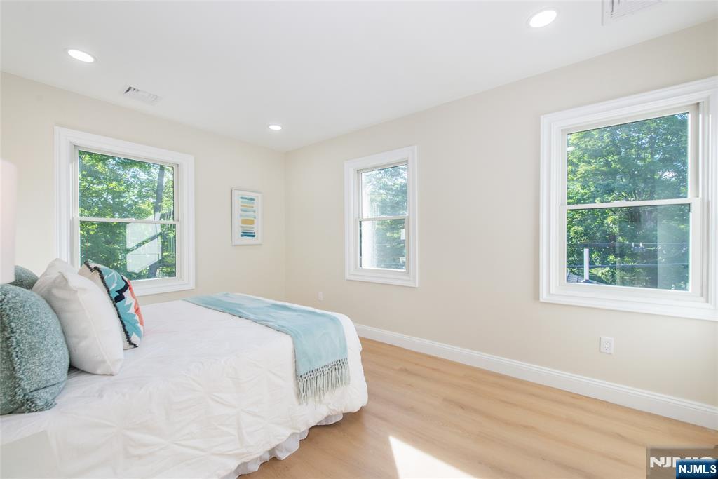 145 Grove Street Mahwah, NJ 07430 - Photo 17 of 30 a bedroom with a bed and a window