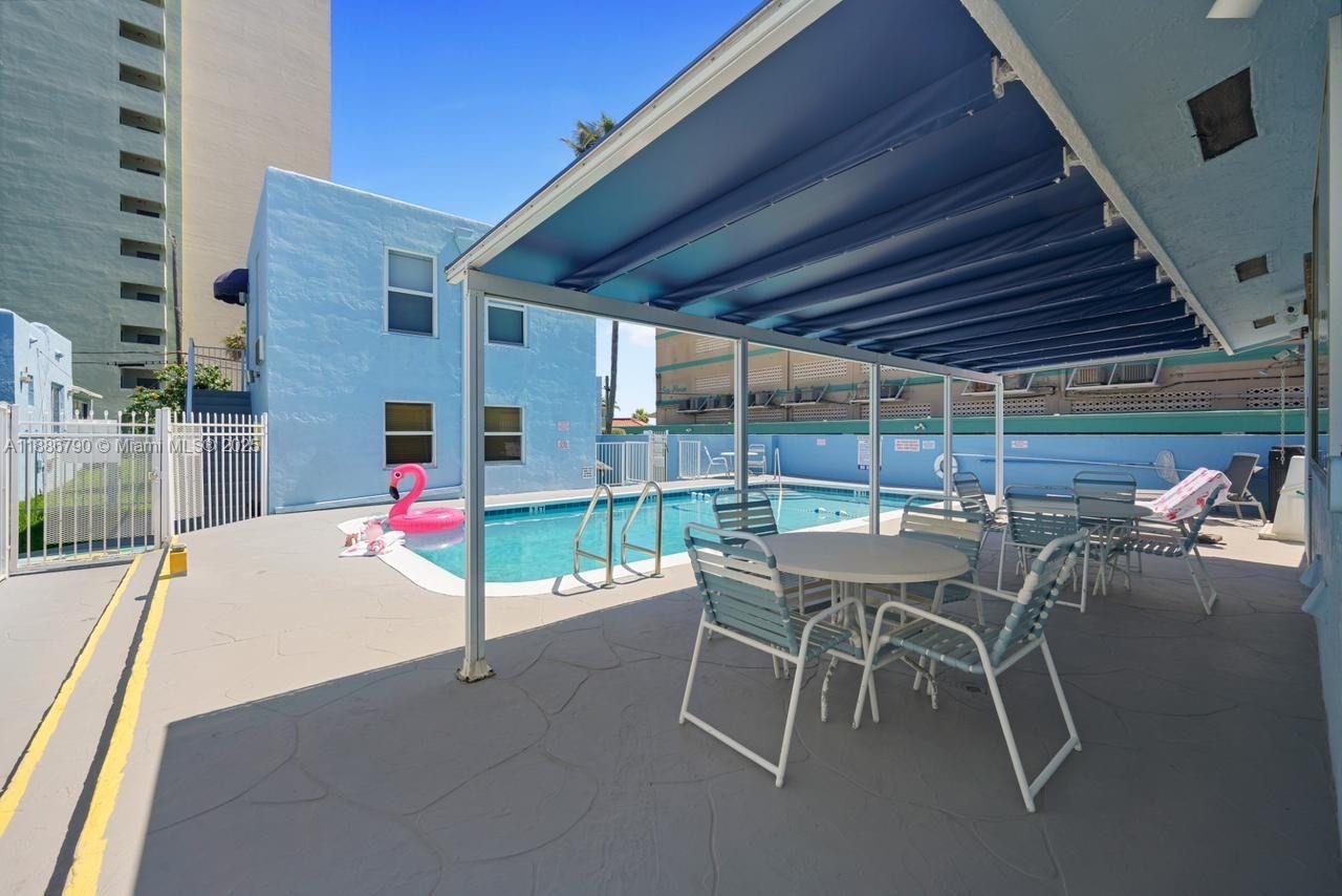 315 Van Buren Street, Unit 104B Hollywood, FL 33019 - Photo 14 of 22 a view of a backyard with a patio