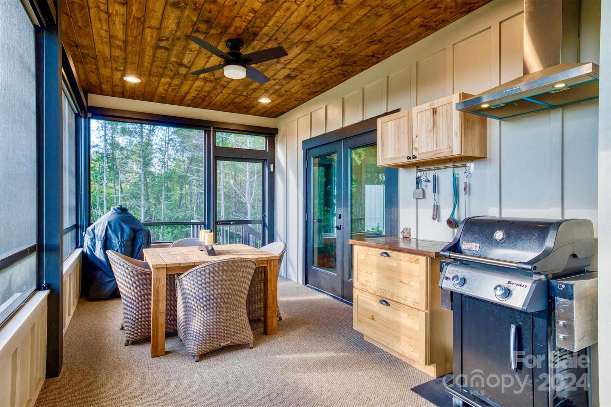 6140 Painted Rdg Trail Lenoir, NC 28645 - Photo 12 of 47 a dining room with furniture and a floor to ceiling window