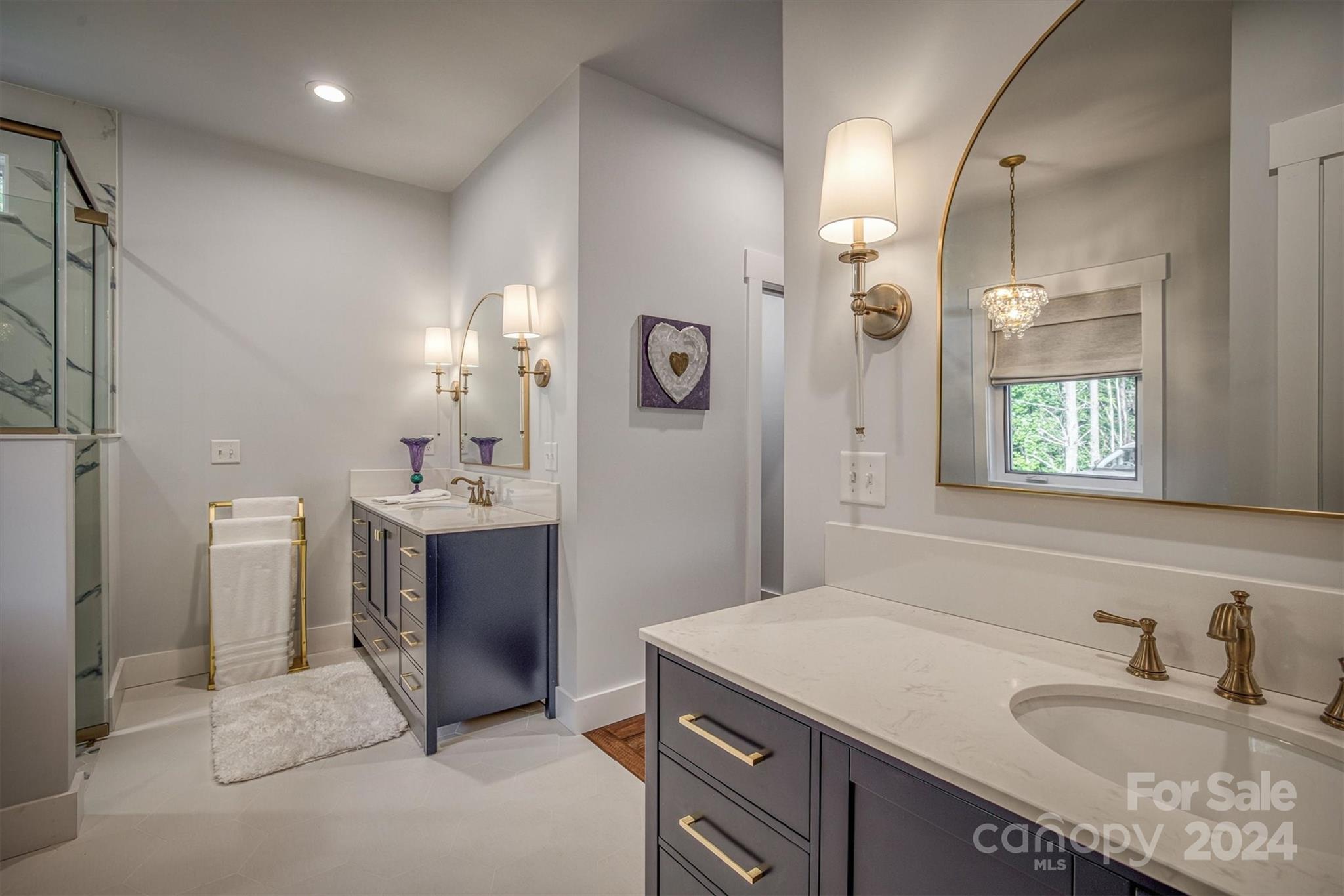 6140 Painted Rdg Trail Lenoir, NC 28645 - Photo 16 of 47 a bathroom with a sink double vanity and a mirror