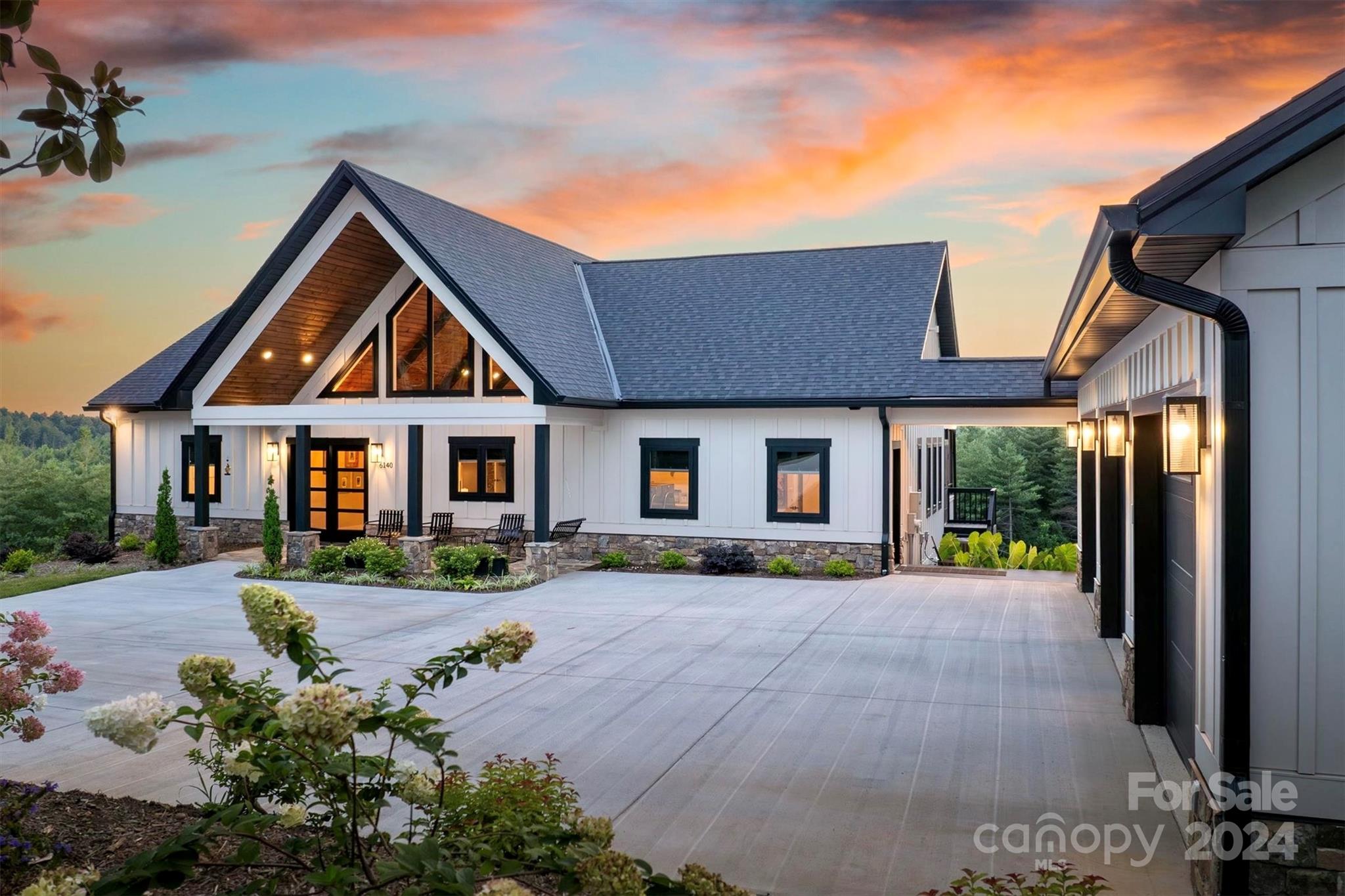 6140 Painted Rdg Trail Lenoir, NC 28645 - Photo 2 of 47 a front view of a house with garden