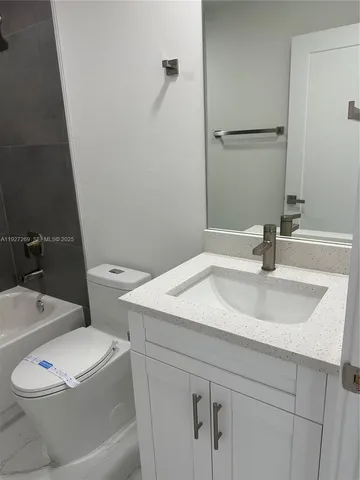 a bathroom with a sink and a toilet