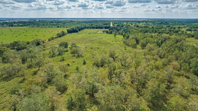 a view of a field with an outdoor space