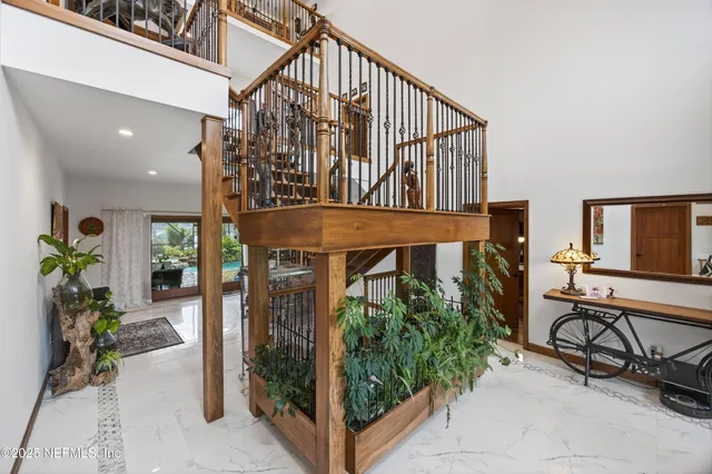 a spacious bedroom with bed and a large window