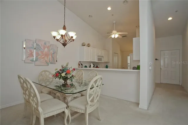 a living room with furniture chandelier and a chandelier