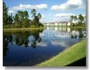 5270 Hyland Hills Avenue, Unit 1722 Sarasota, FL 34241 - Photo 2 of 30 a view of a lake