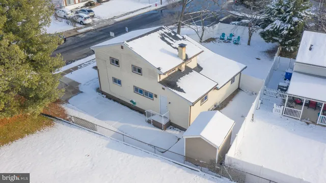 an aerial view of a house with a ocean view