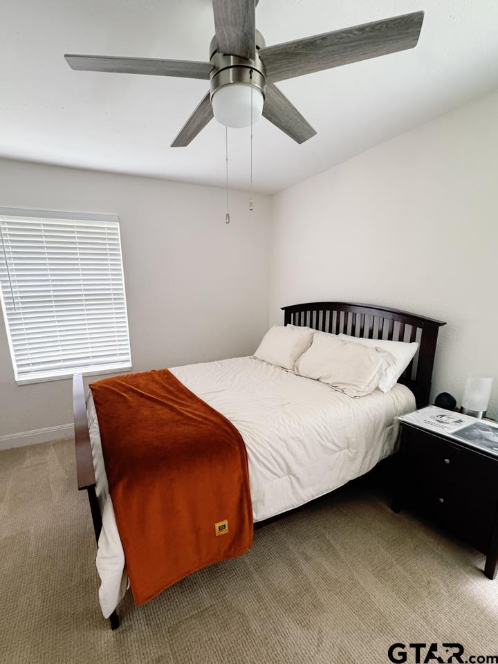 2411 Rodge Drive Tyler, TX 75701 - Photo 31 of 42 a bedroom with a bed and window