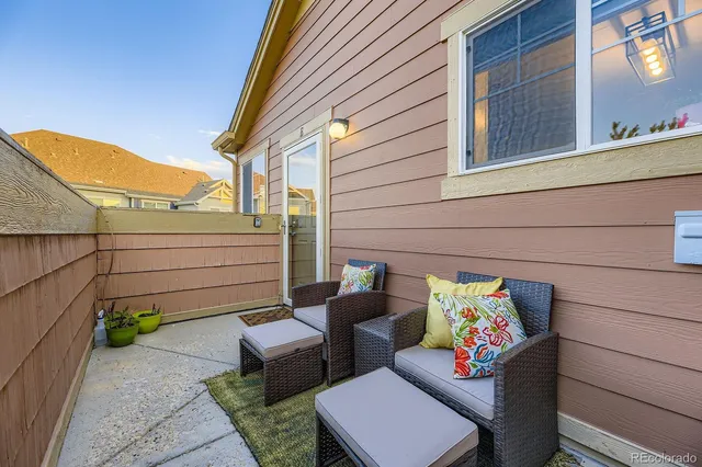 a view of a chairs in back yard of the house