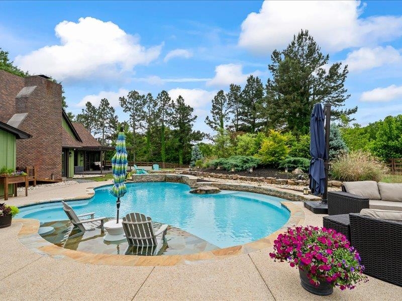 8104 Jack Bond Road Arlington, TN 38002 - Photo 29 of 40 a view of a swimming pool with a lounge chairs