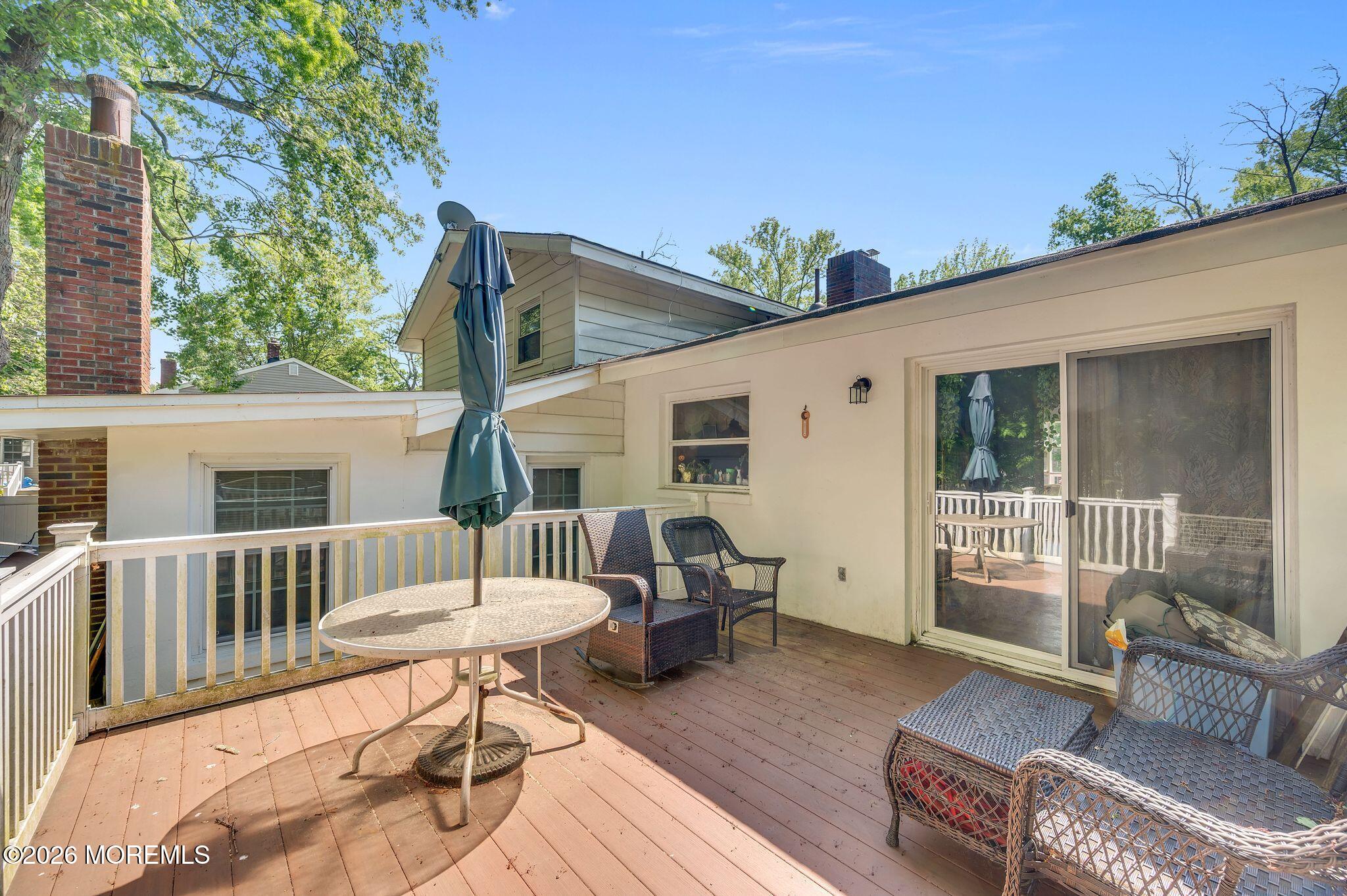 2604 Logan Road Asbury Park, NJ 07712 - Photo 25 of 39 a view of a patio with couches chairs and wooden floor