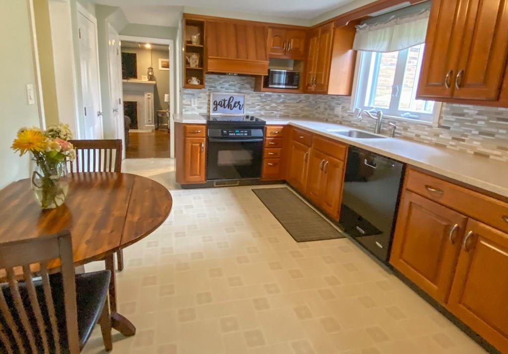 60 Old Brook Road Springfield, MA 01118 - Photo 8 of 42 a kitchen with stainless steel appliances granite countertop a sink stove and refrigerator