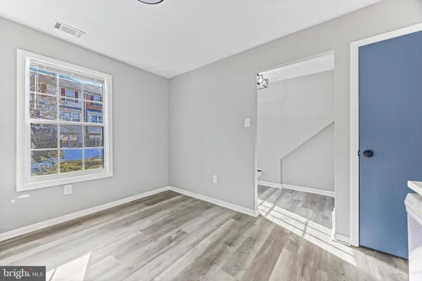 a view of empty room with windows