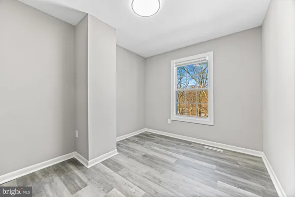 a view of room with window and closet
