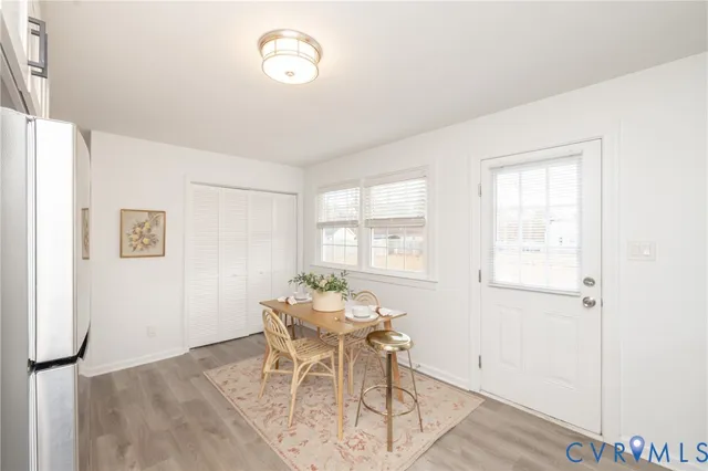 a dining room with furniture and window