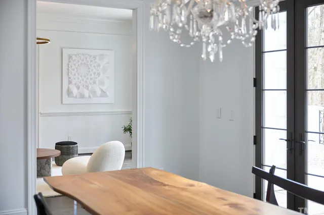 a view of a room with furniture and wooden floor