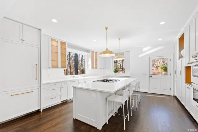 a living room with furniture and a painting on the wall