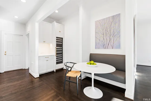 a spacious bedroom with a balcony a bed and a fireplace