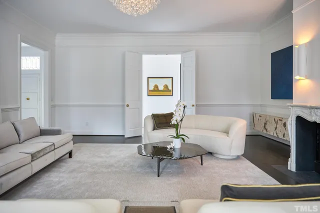 a bathroom with a bathtub a shower and a window