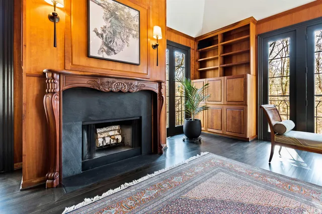 a view of a patio with table and chairs with wooden floor and fence