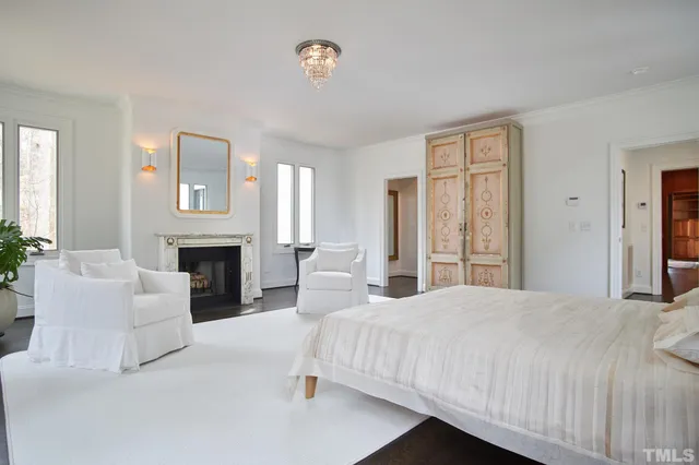 a kitchen with granite countertop a sink a stove top oven and cabinetry