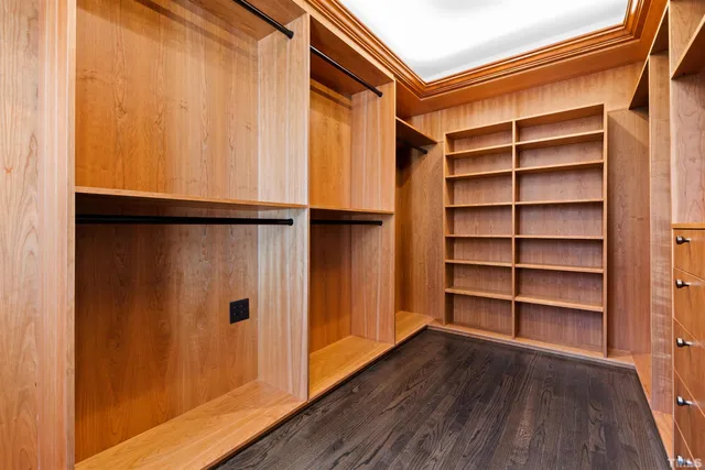 a front view of a multi story residential apartment building with yard and outdoor seating