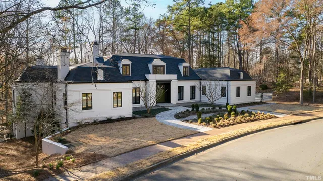 a view of a livingroom with furniture and a potted plant