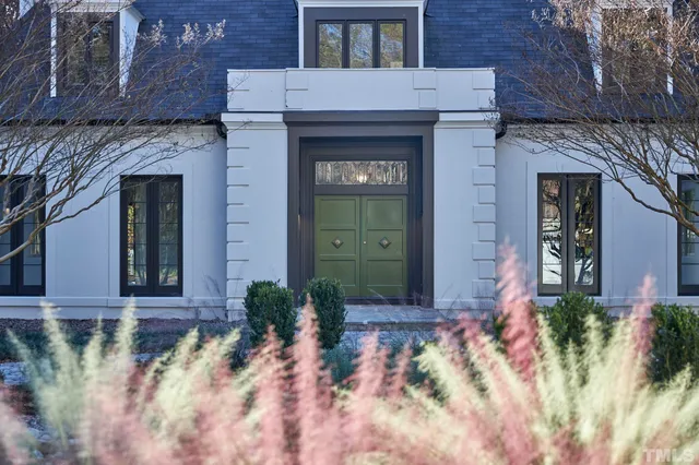 a dining room with a table and chairs