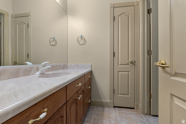 389 North Main Street St. George, UT 84770 - Photo 36 of 44 Bathroom with vanity, a closet, and light tile patterned flooring