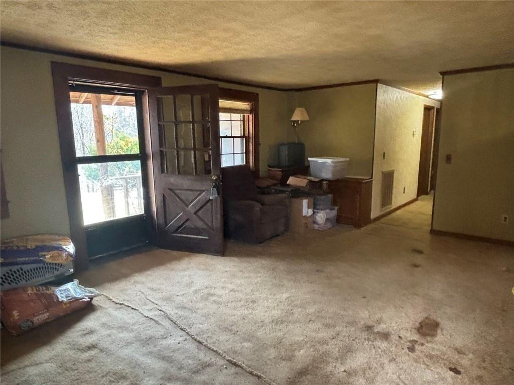 292 Shirley Road Southeast Ranger, GA 30734 - Photo 26 of 80 a living room with furniture and a window