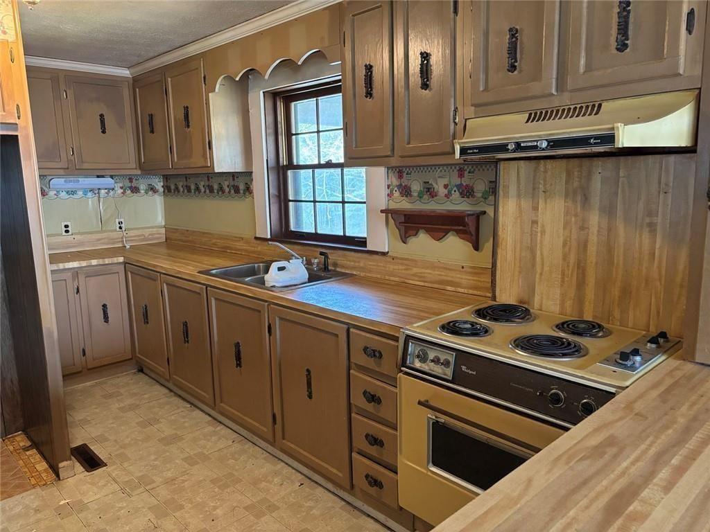292 Shirley Road Southeast Ranger, GA 30734 - Photo 28 of 80 a kitchen with granite countertop a stove and a sink