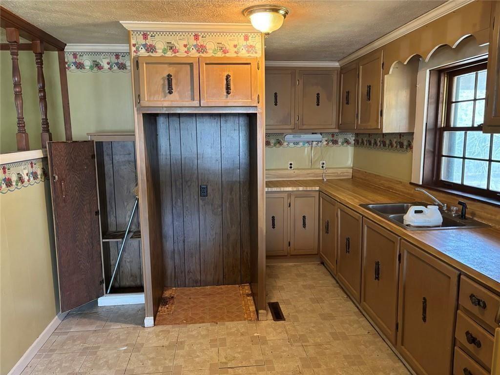 292 Shirley Road Southeast Ranger, GA 30734 - Photo 29 of 80 a kitchen with stainless steel appliances granite countertop a refrigerator and a sink