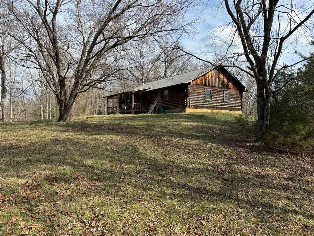 292 Shirley Road Southeast Ranger, GA 30734 - Photo 9 of 80 a front view of a house with a yard